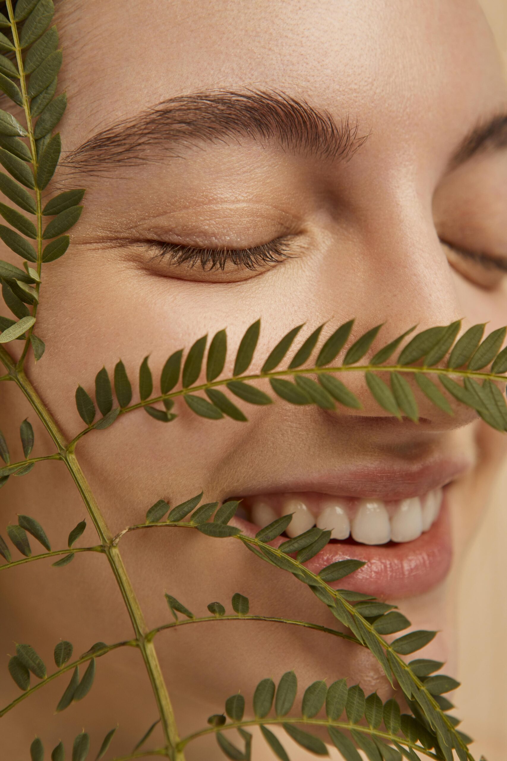 close-up-smiley-model-posing-with-plant