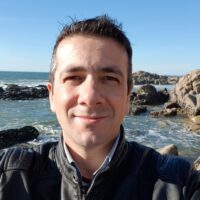 portrait-man-beach-against-clear-sky